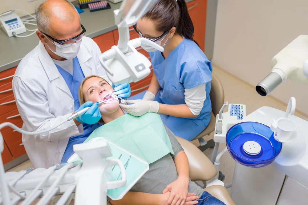 woman getting a cleaning with Hickory, NC Dentist