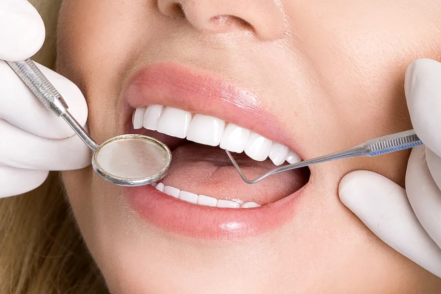dental patient holding veneers concord nc for placement