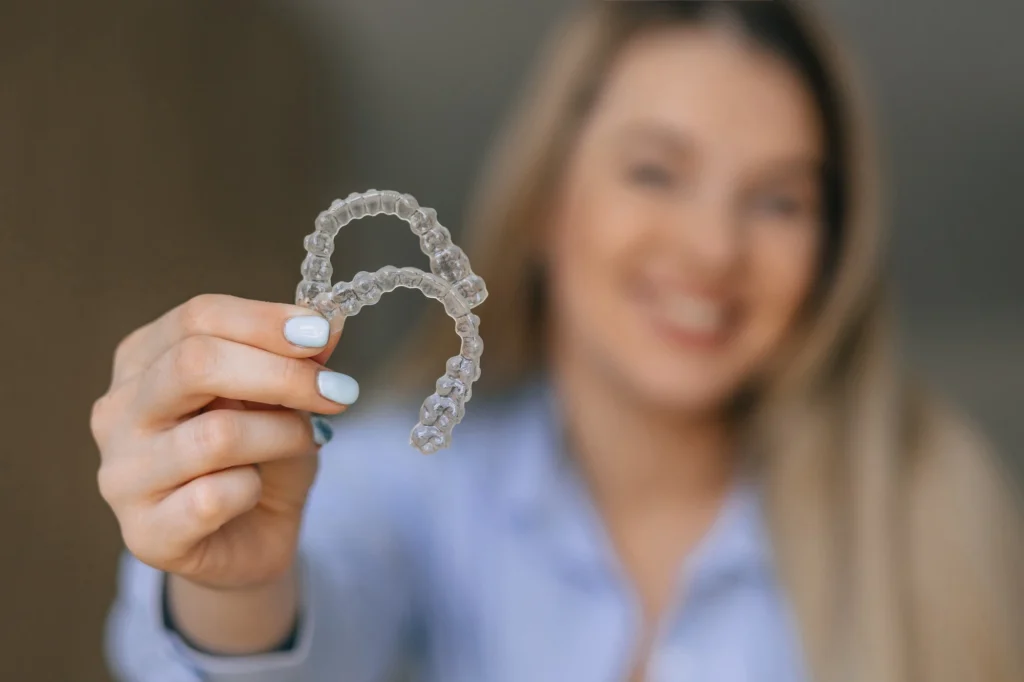 clear aligners concord nc woman holding aligners