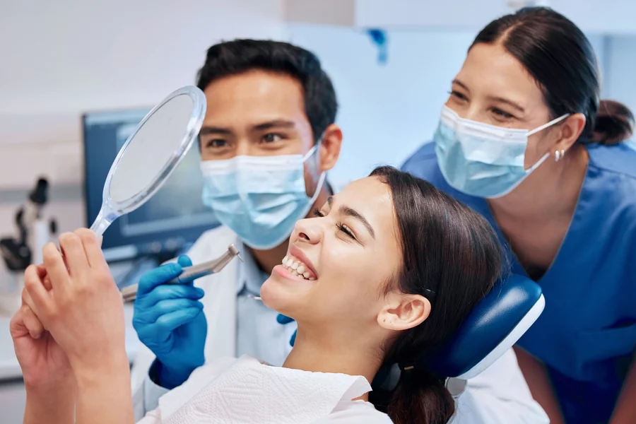 patient-smiling-after-visit-with-same-day-dentist-in-28602 (1)