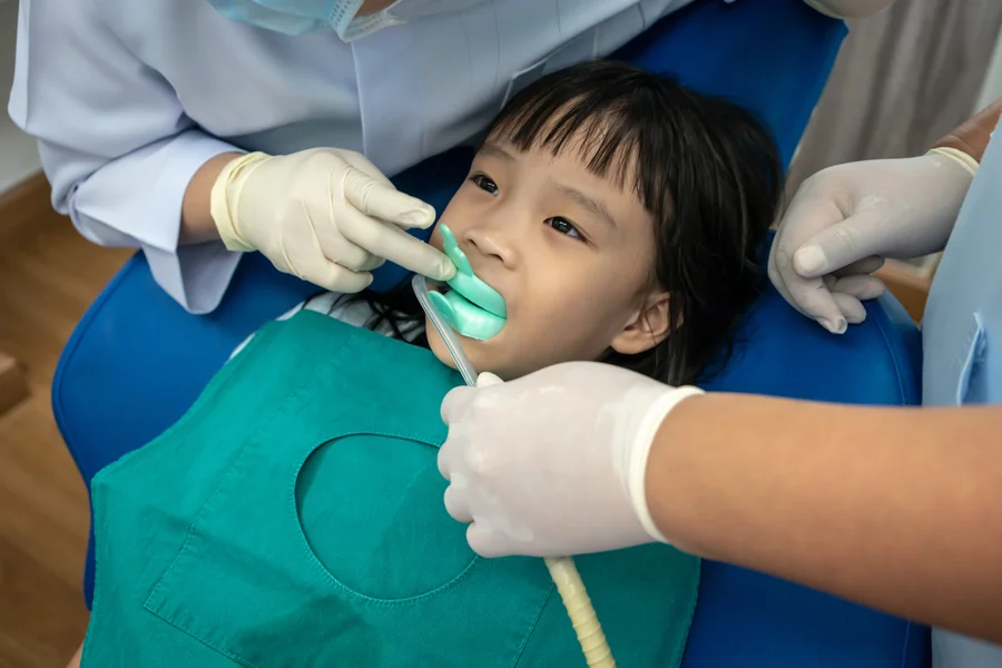 fluoride treatment gastonia child receiving fluoride tray treatment